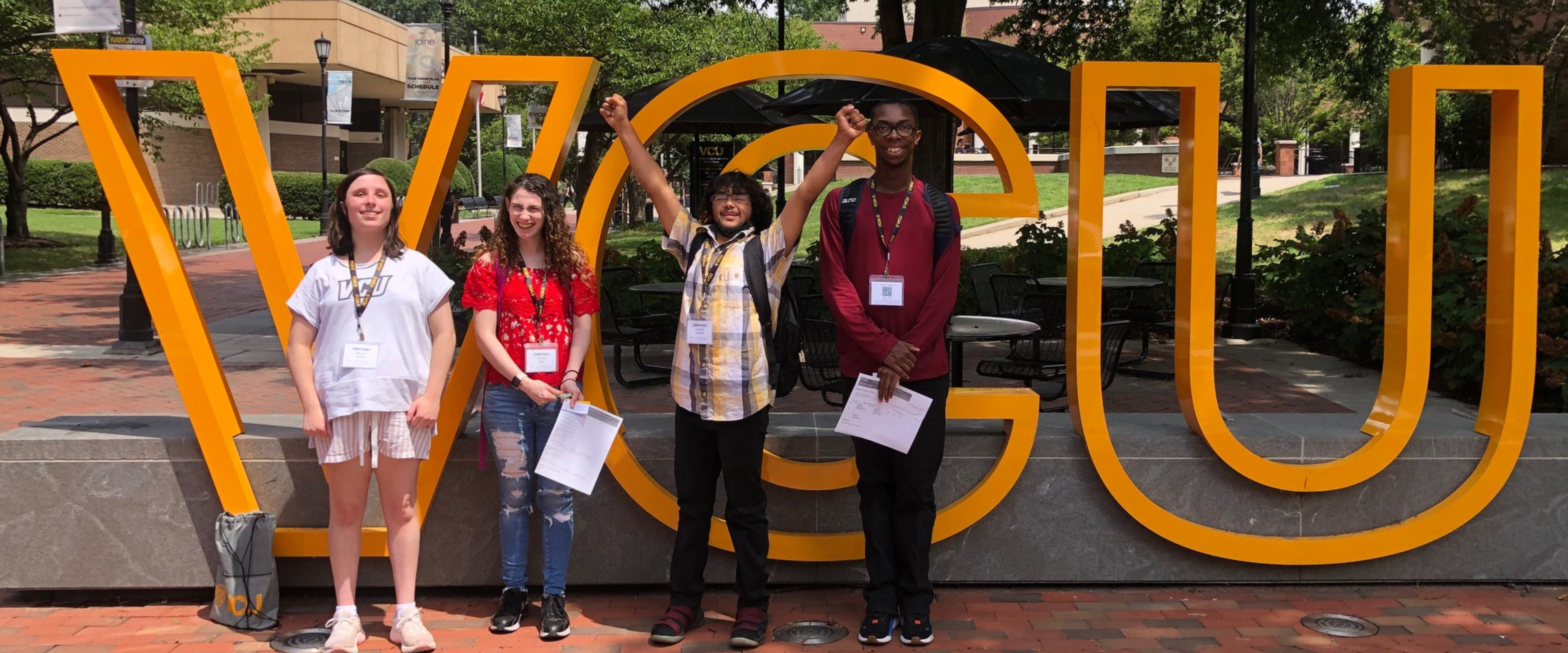 aceit students Infront of VCU logo