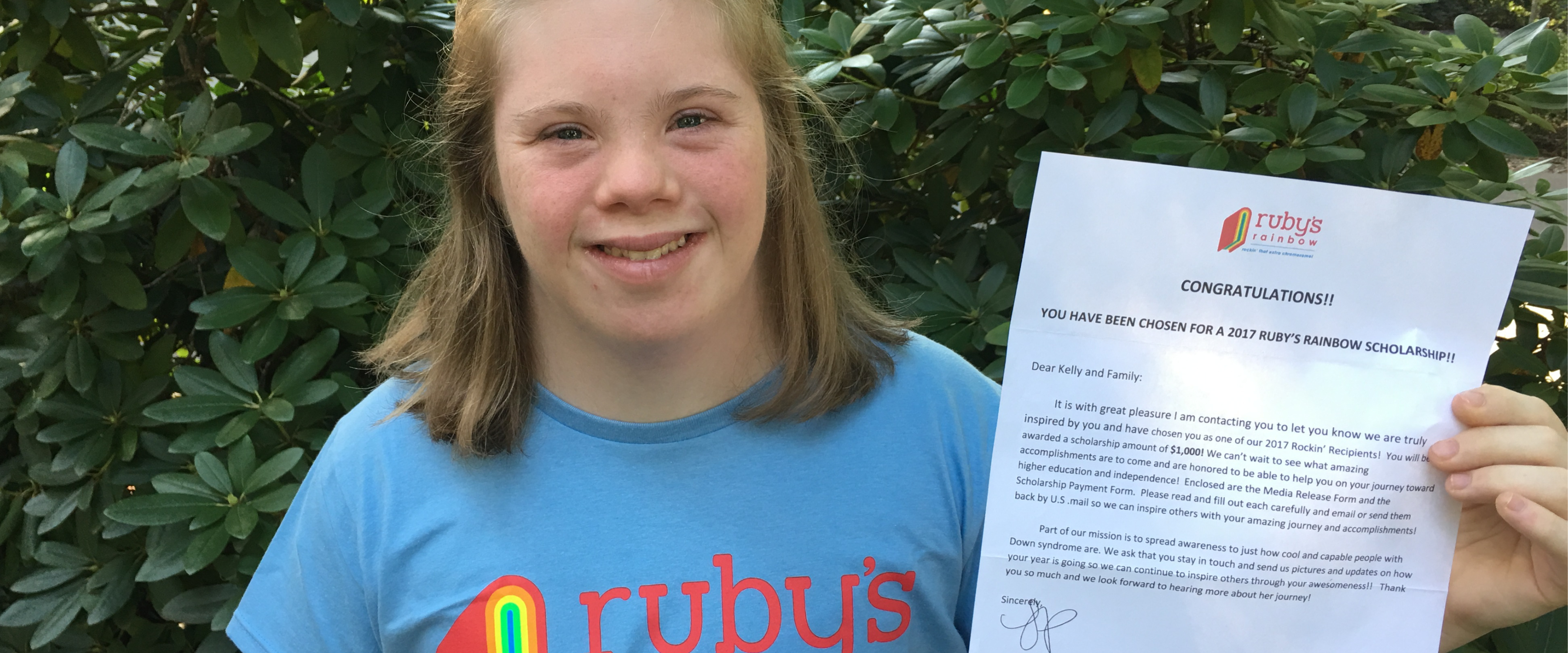 A student with her certificate